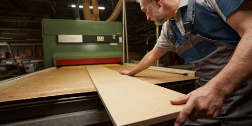 attentive-male-person-working-at-woodworking-manuf-2022-01-04-22-22-58-utc ajuster